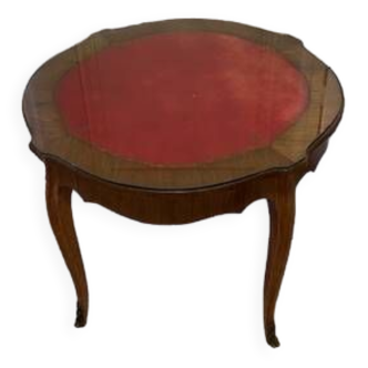 Round table with red leather top