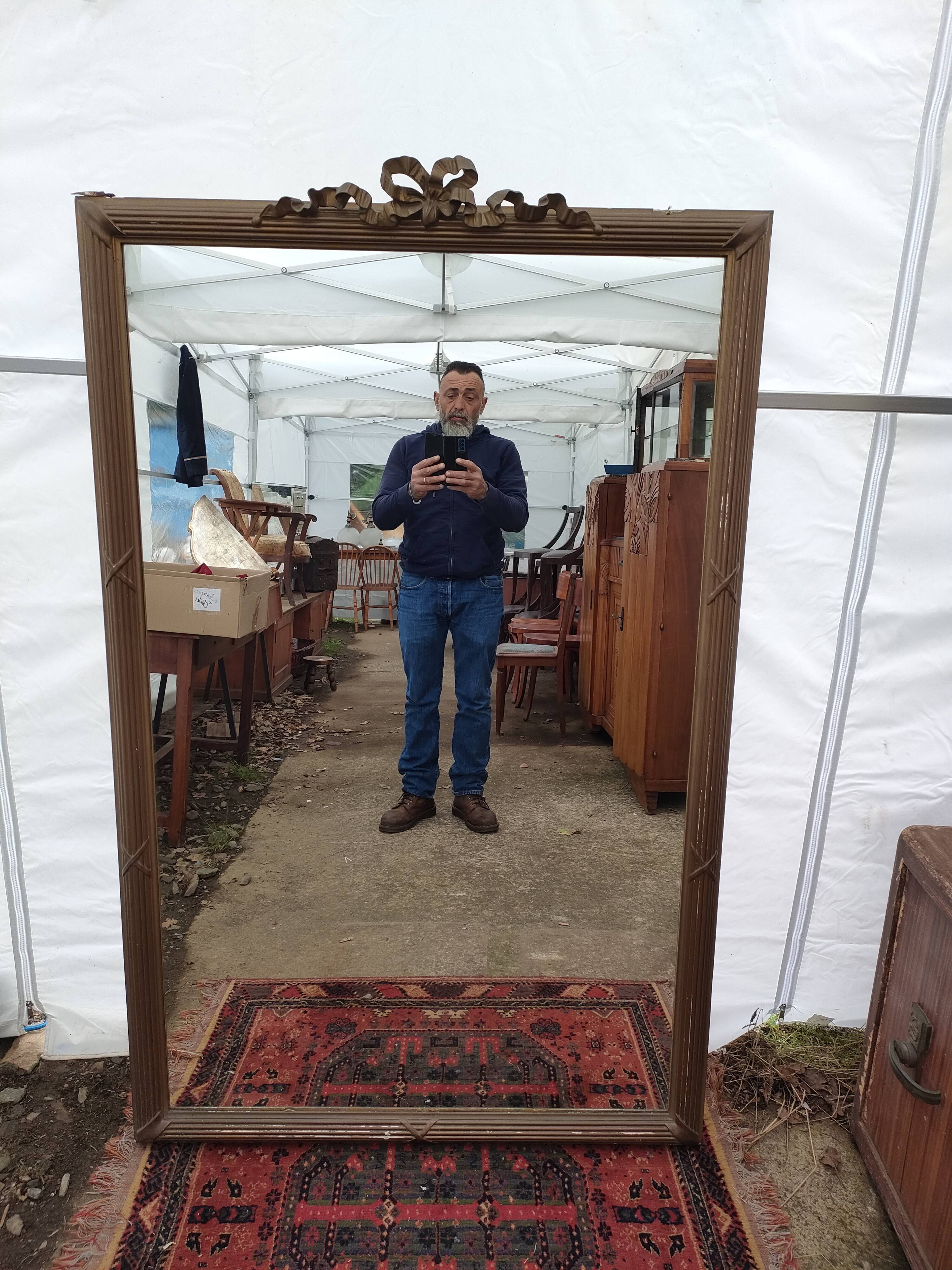 Antique mirror in gilded wood, 105x166 cm