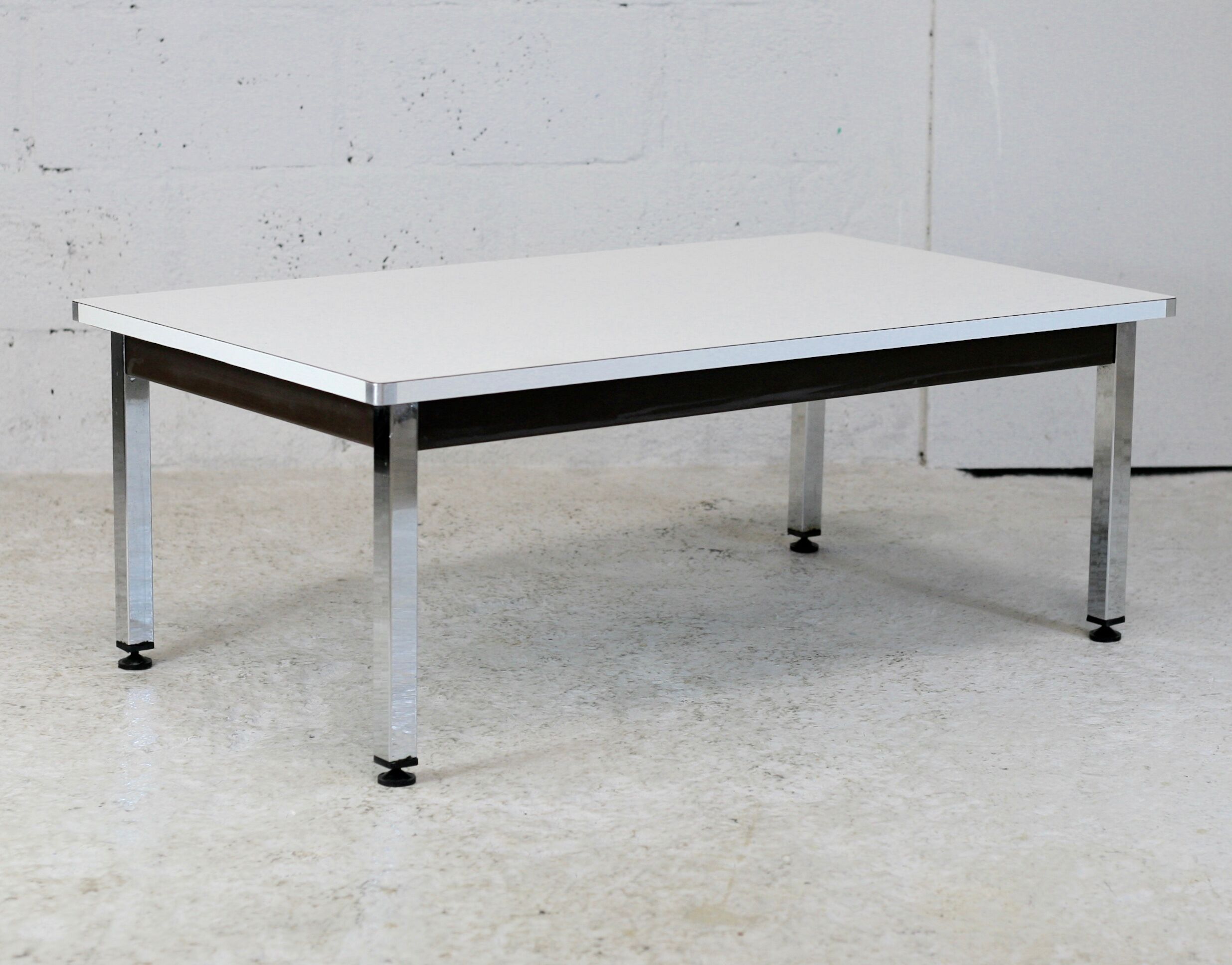 Coffee table chrome steel base, white melaminate top. France, circa 1970.