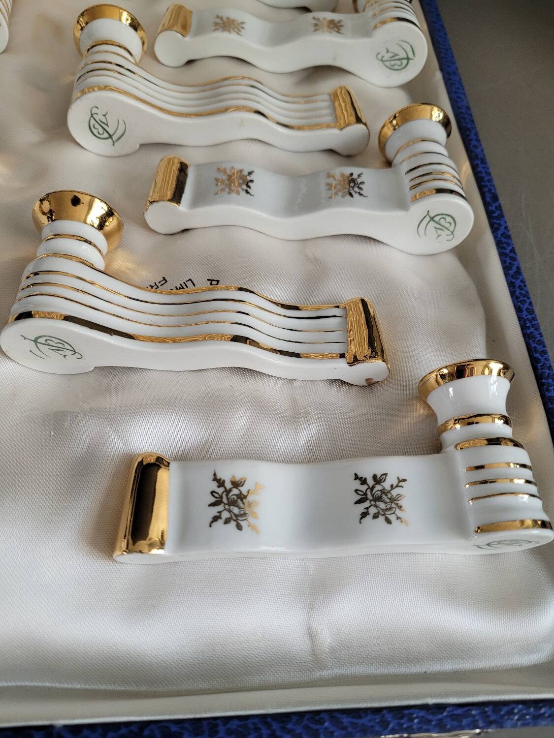 12 Limoges art porcelain knife rests in their case