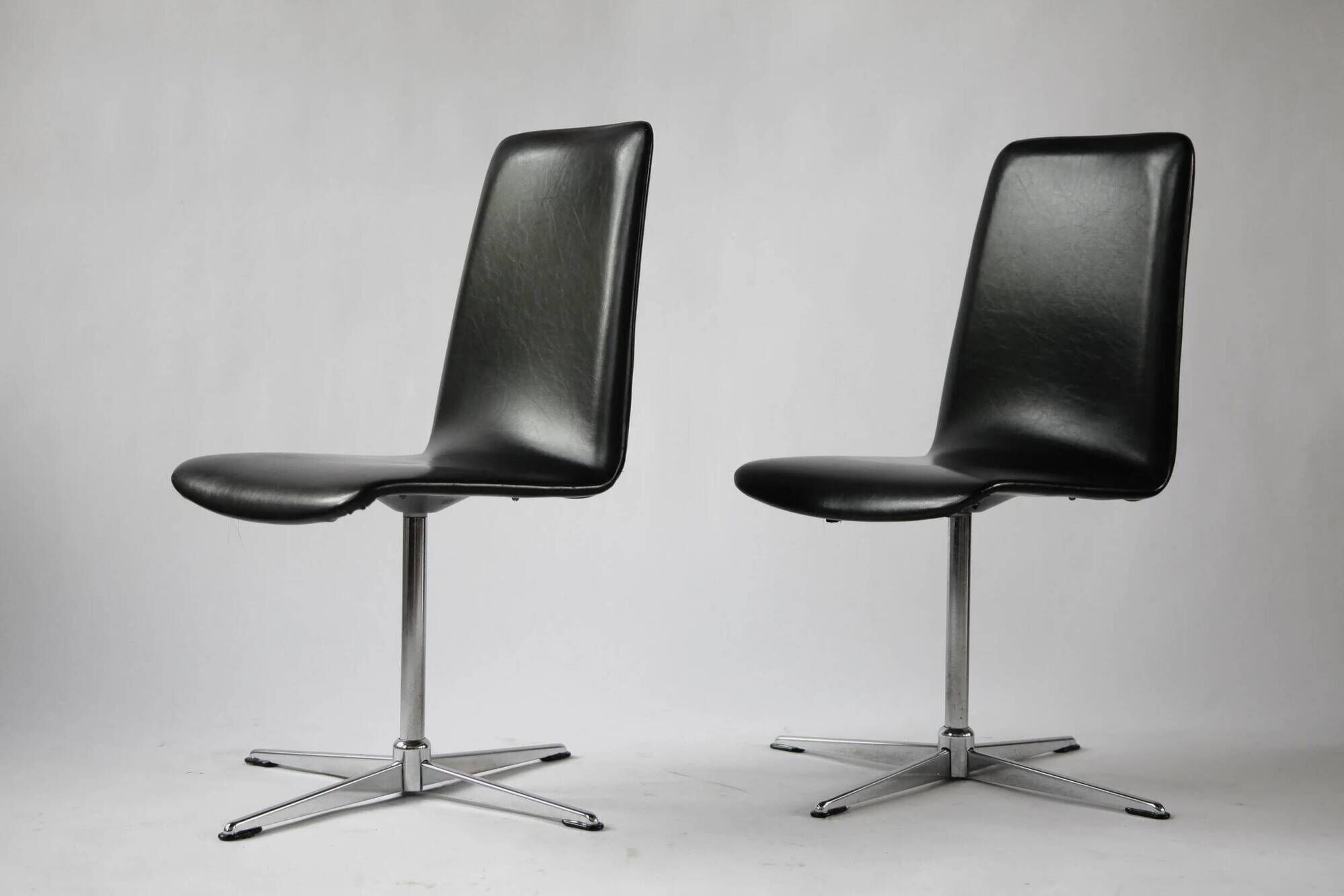 Pair of vintage swivel armchairs in black vinyl, 1970s