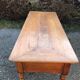Antique cherry farmhouse table with turned legs and 2 drawers.