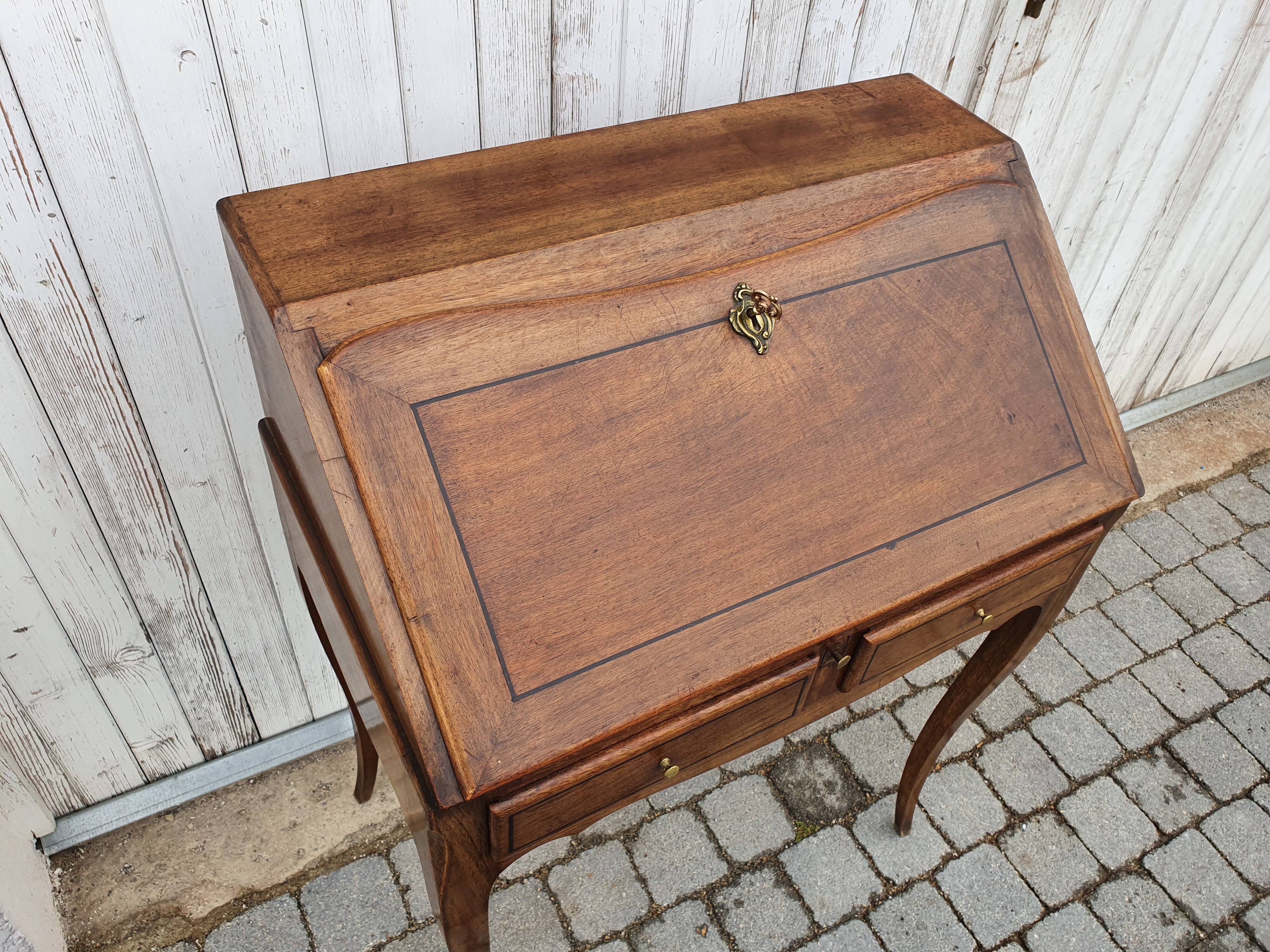 Former small secretary office with a walnut Louis XV