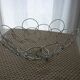 Fruit cut basket made of metal wire, ball feet