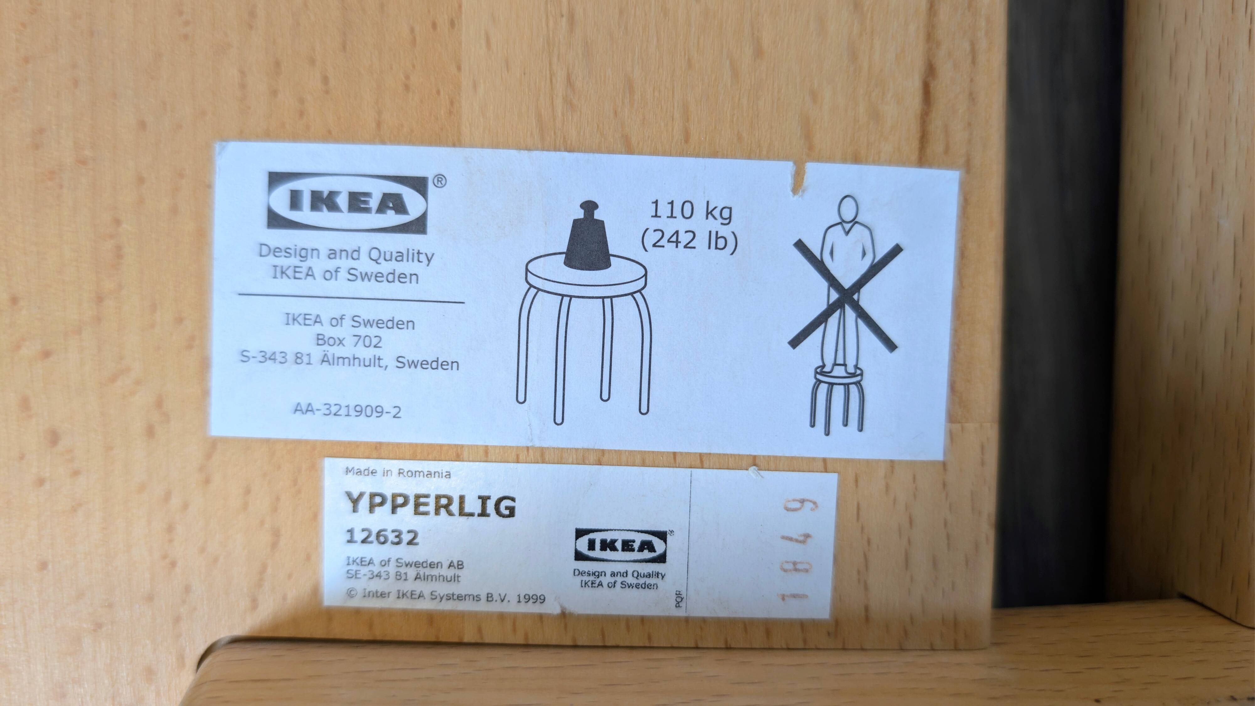 Nordic design wooden stool model ypperlig by ikea with a minimalist seat.