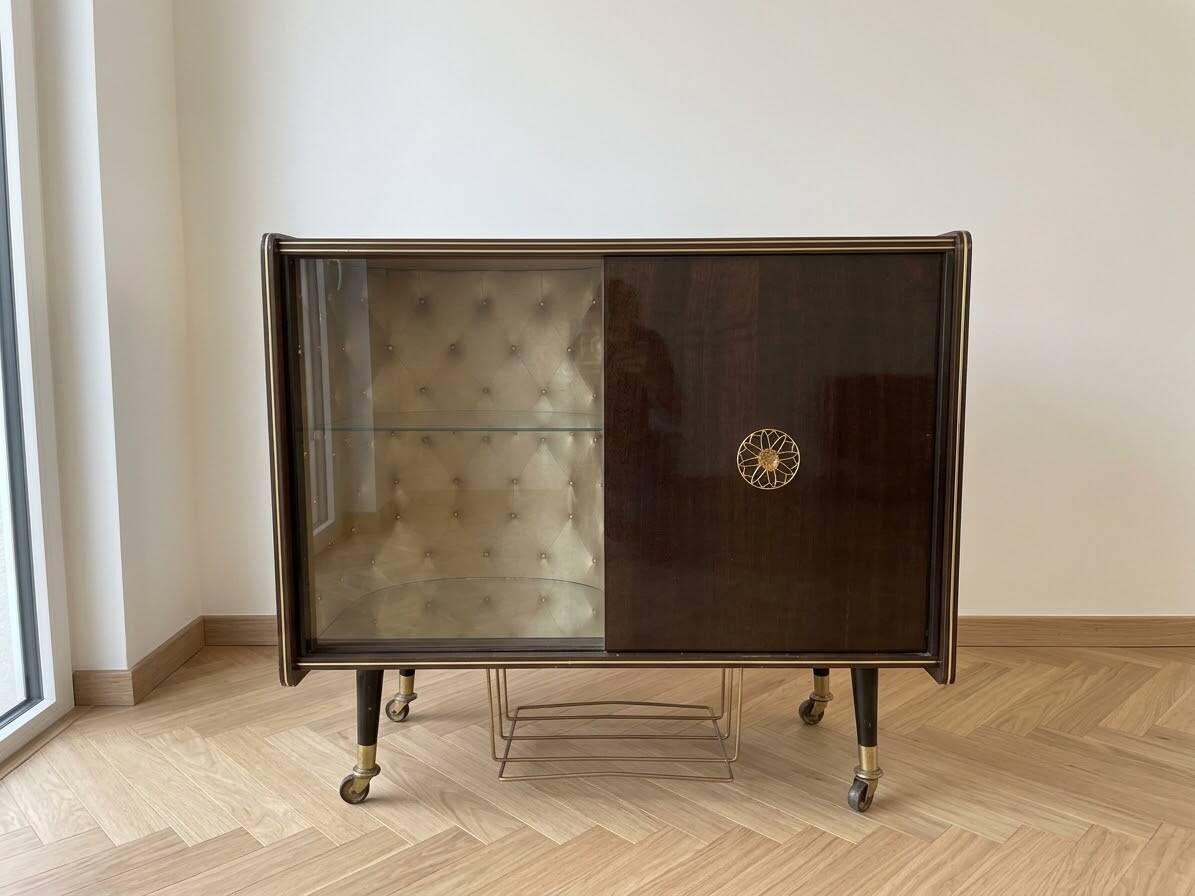 Vintage 1950s TV cabinet in wood with gold details.