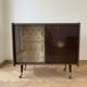 Vintage 1950s TV cabinet in wood with gold details.