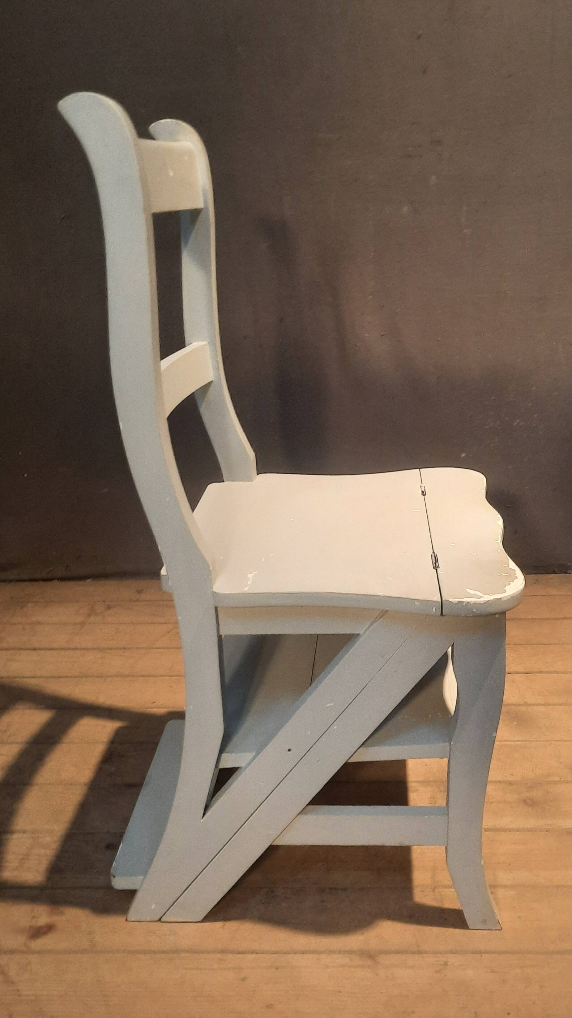 White chair convertible into a staircase.