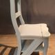 White chair convertible into a staircase.
