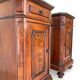 A pair of antique walnut bedside tables from the 1890s.