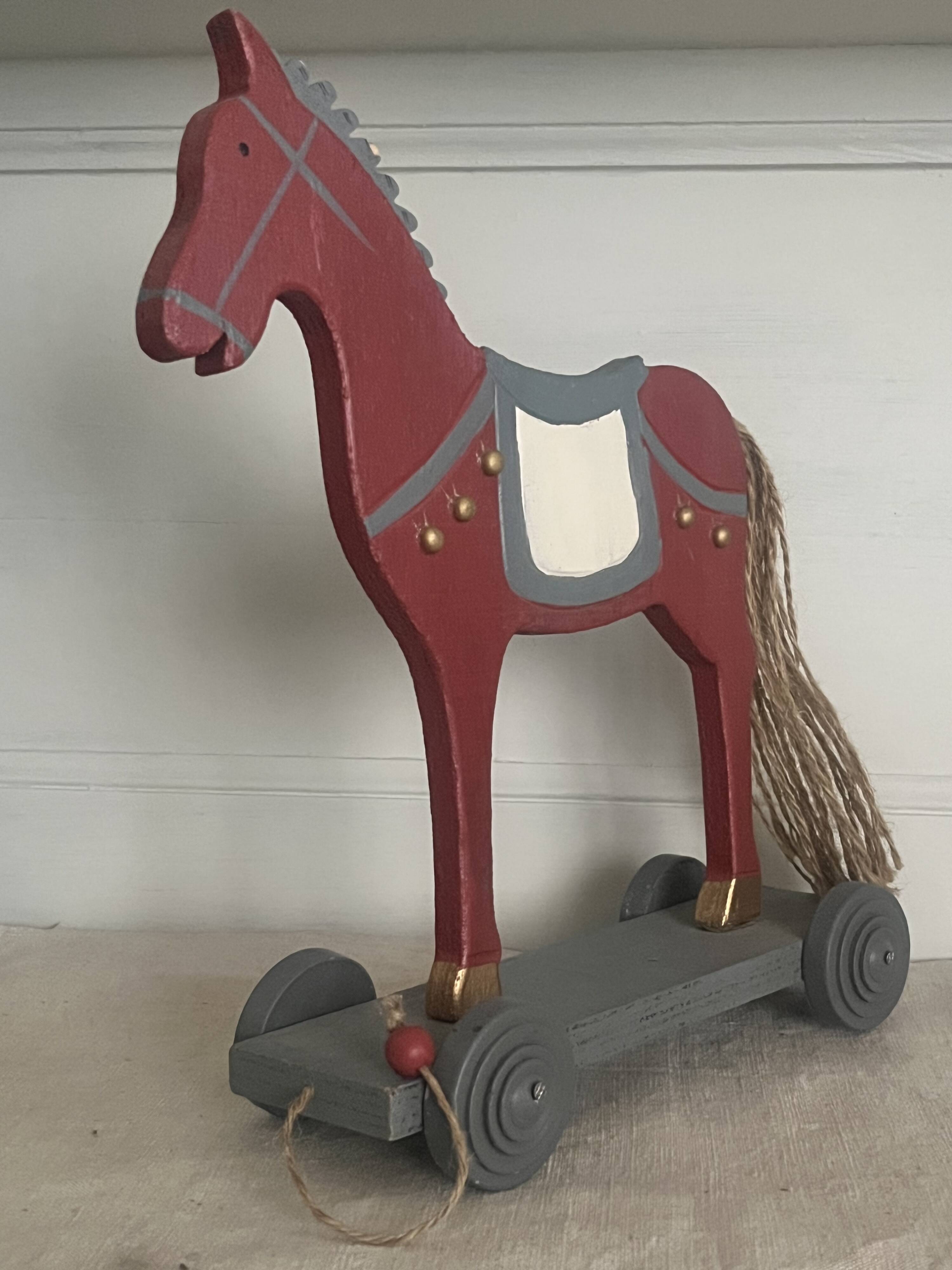 Antique toy, small horse on wheels