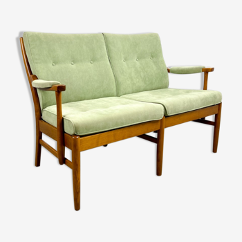 Two-seater sofa from the sixties with green upholstery