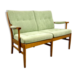 Two-seater sofa from the sixties with green upholstery