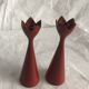 pair of Scandinavian painted wooden candle holders, minimalist atmosphere, free form