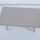 Small vintage wooden bench renovated in pinkish beige