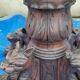 Round table in molded and carved oak with quill decoration, central shaft with 4 runners