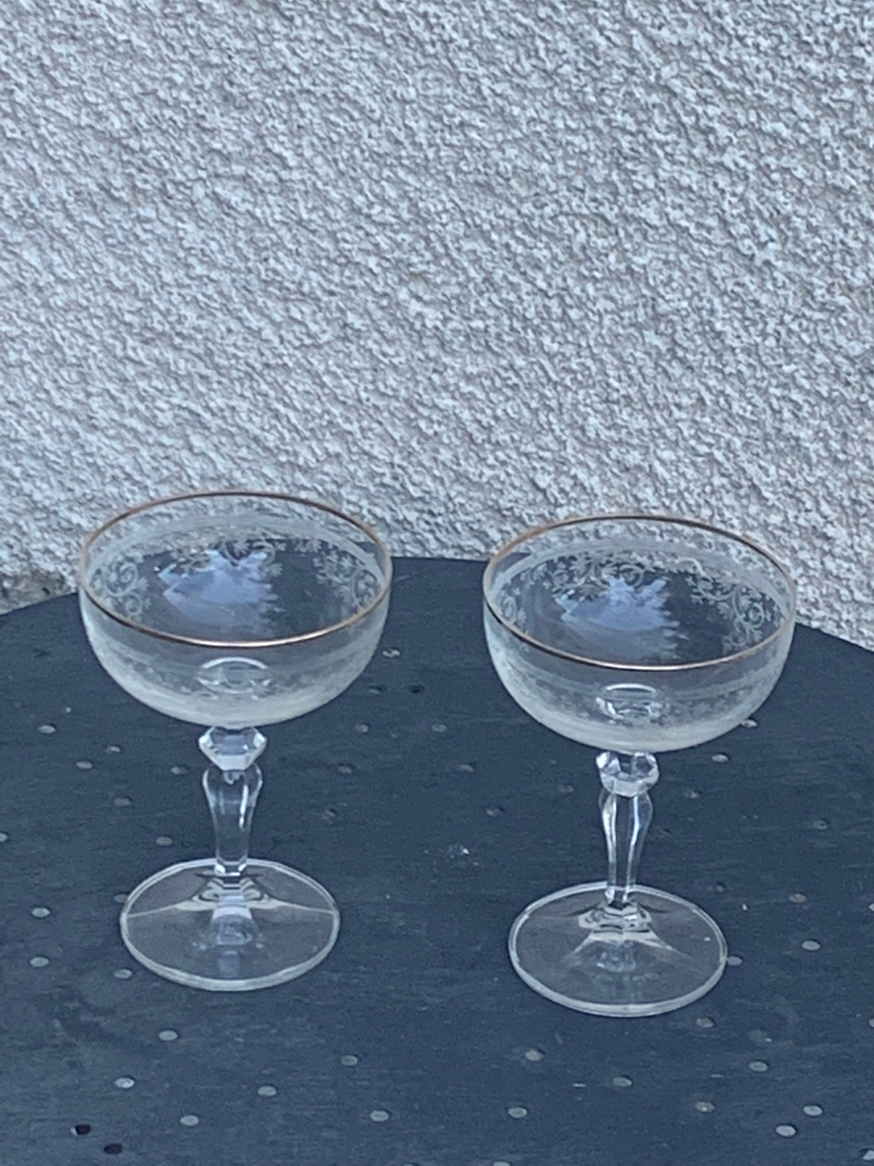 Two crystal champagne glasses and gilded borders antique engraved pattern