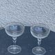 Two crystal champagne glasses and gilded borders antique engraved pattern