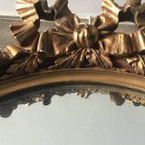 Oval golden mirror