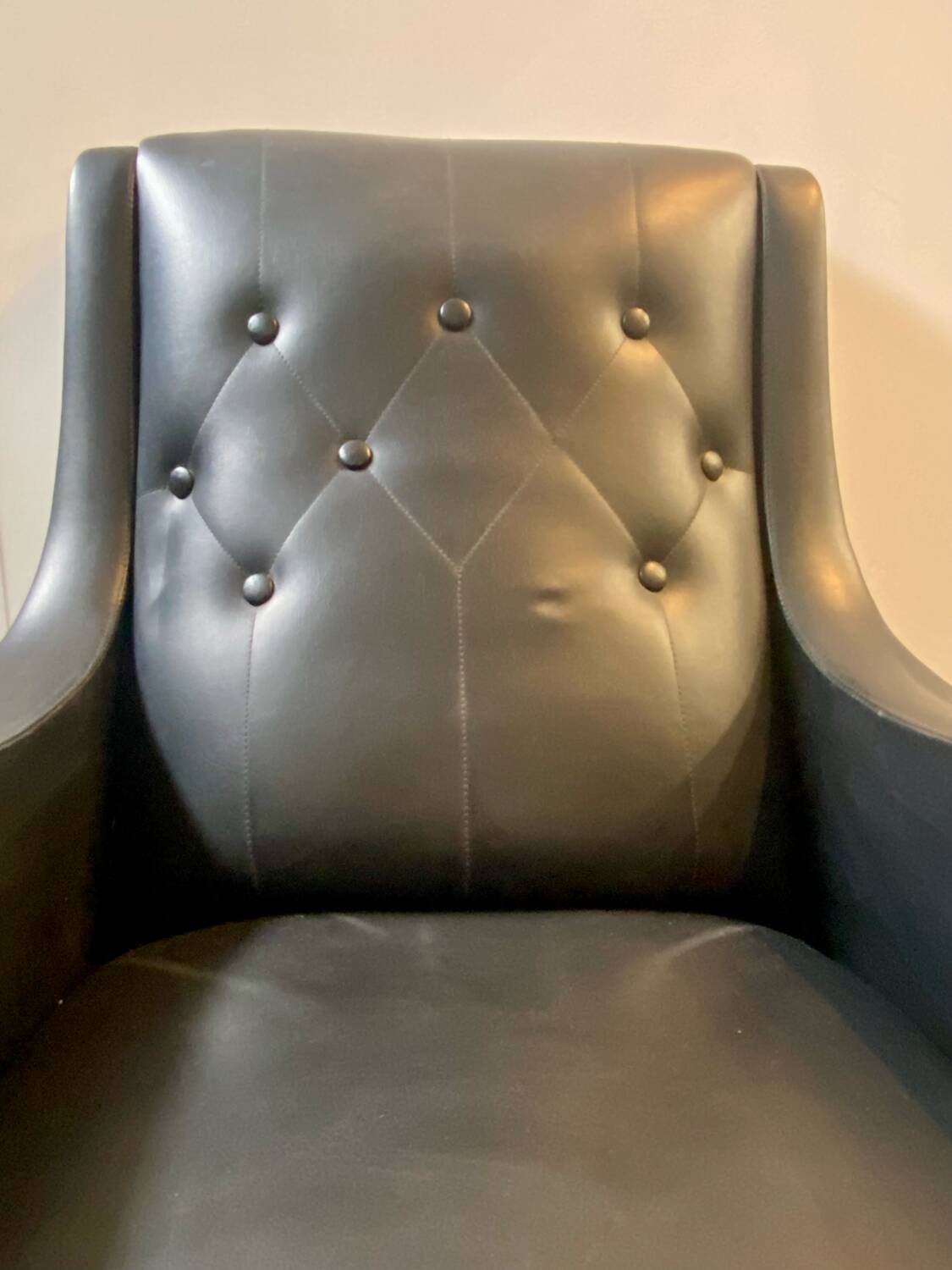 2 vintage faux leather armchairs