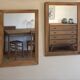 Pair of vintage antique mirrors in raw solid wood.