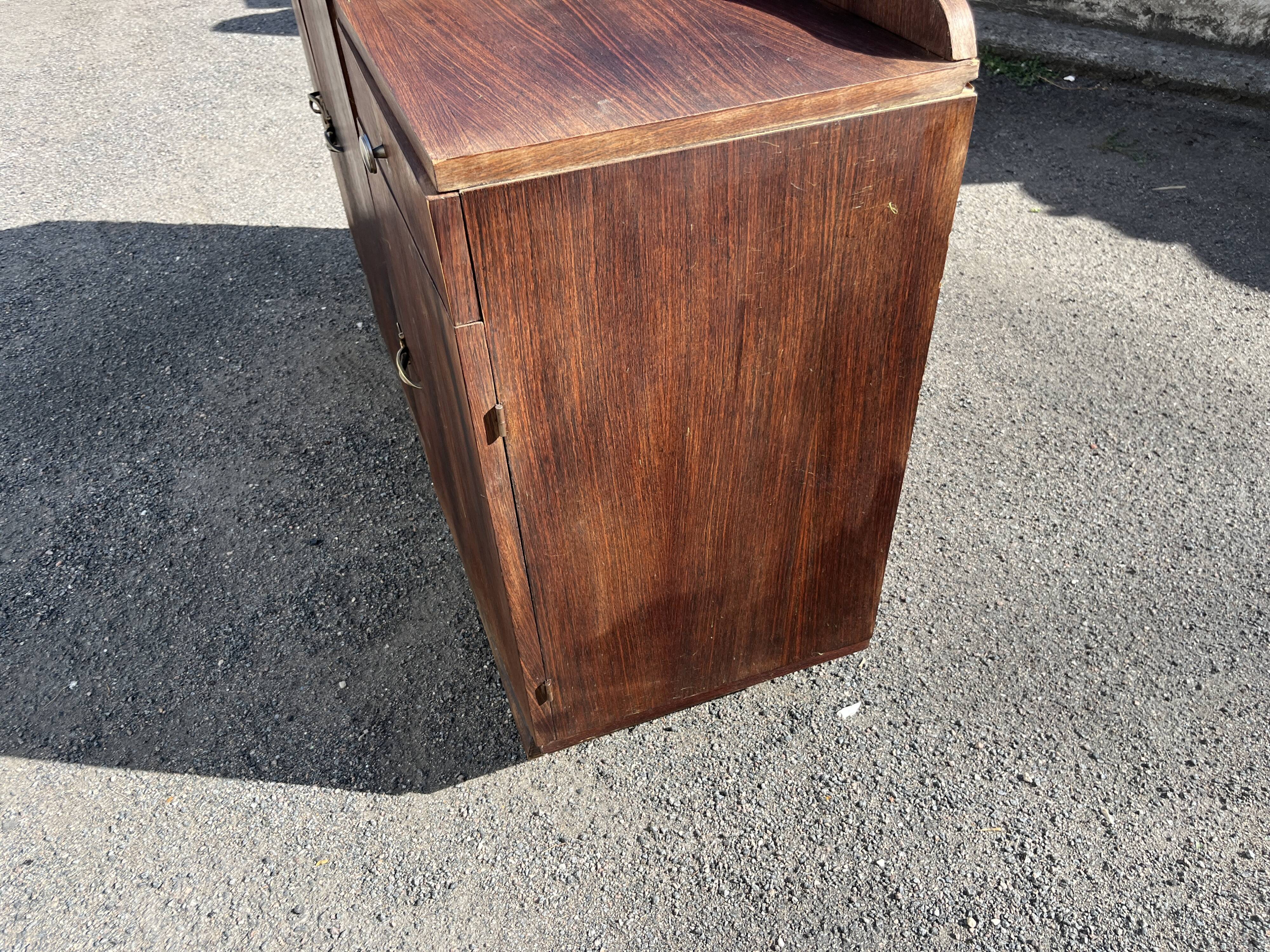 Asymmetrical antique Art Deco sideboard in rosewood veneer.
