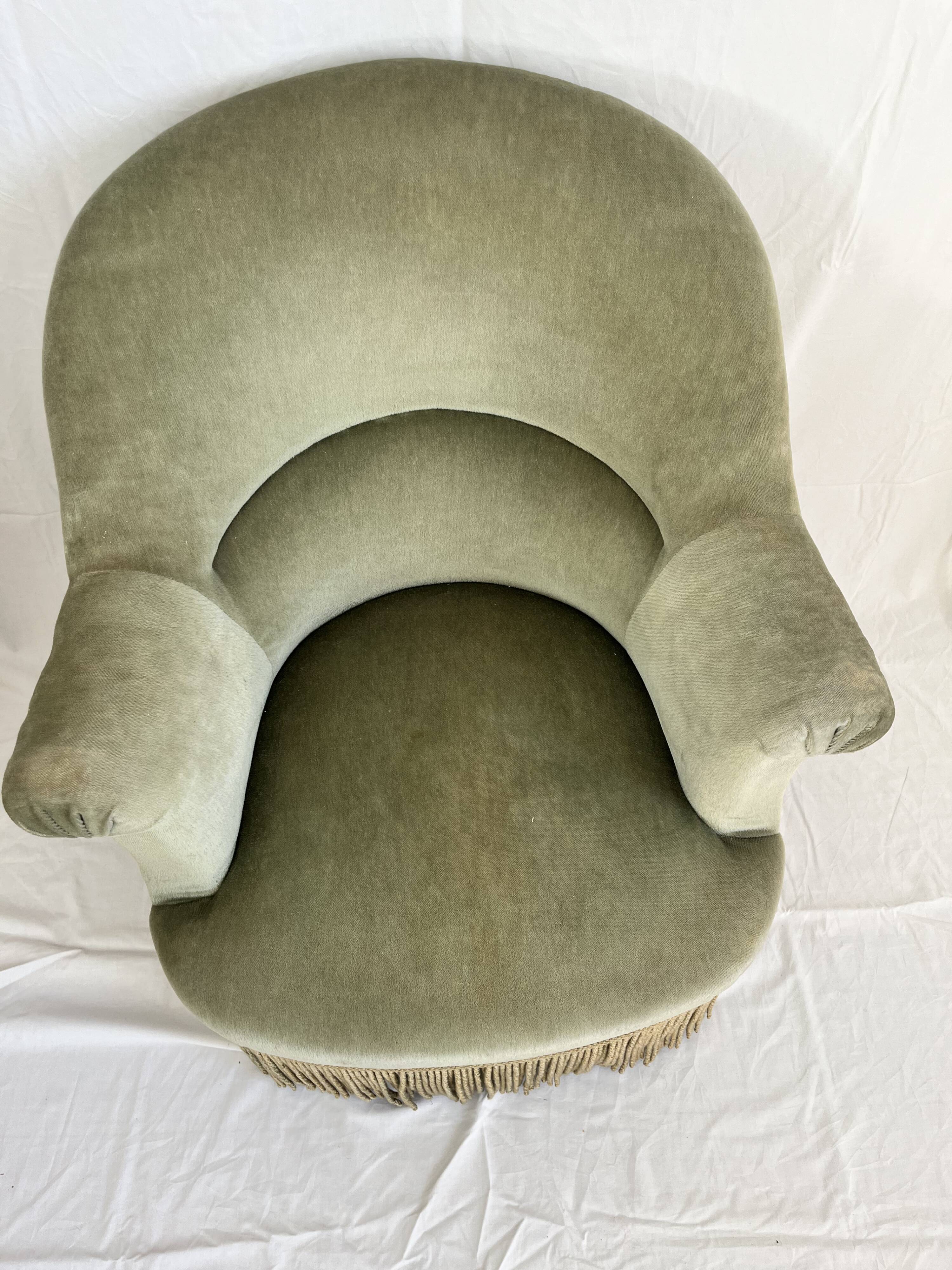sage green toad armchairs with gold fringe