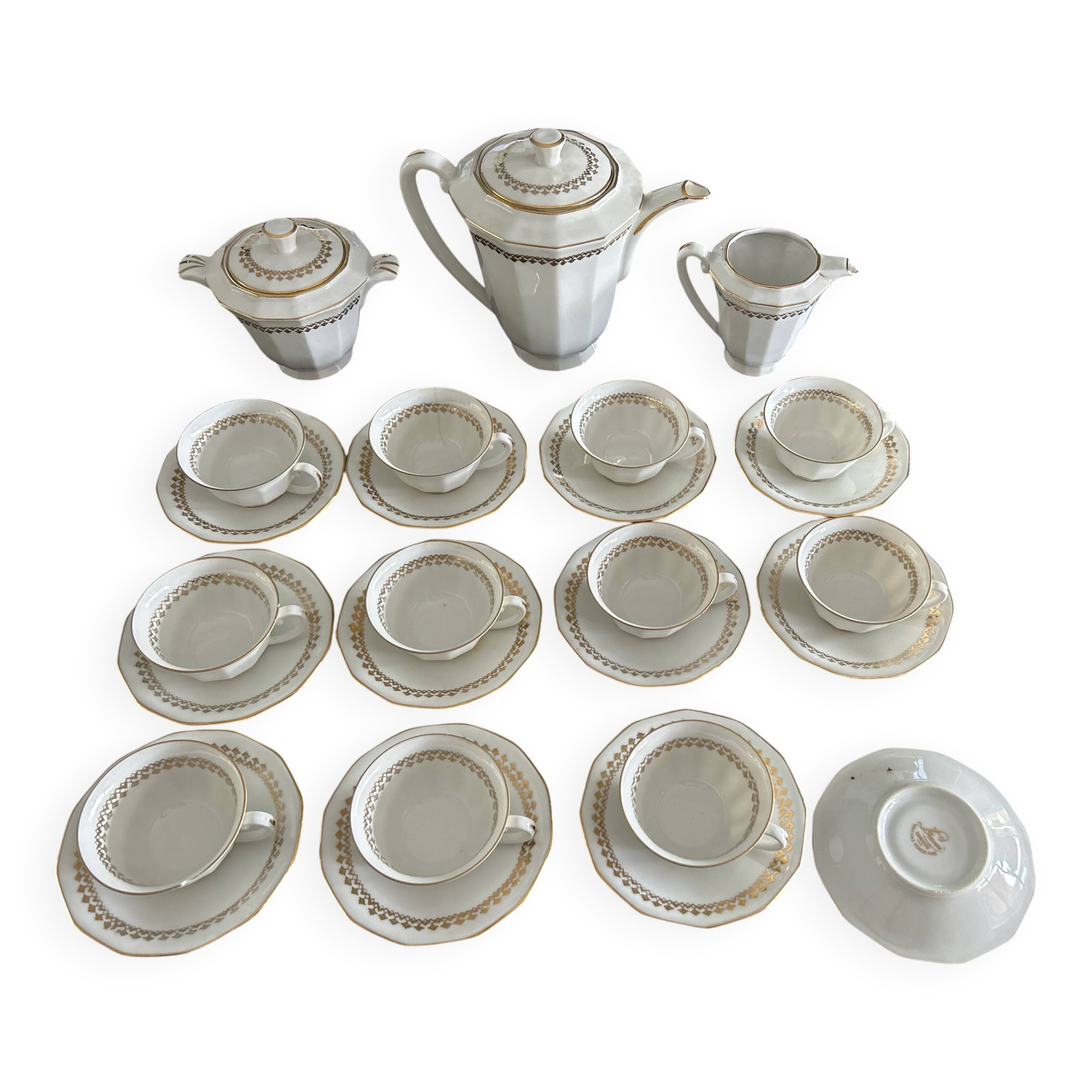 a vintage coffee or tea set in white porcelain with patterns and