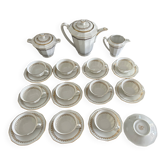 a vintage coffee or tea set in white porcelain with patterns and