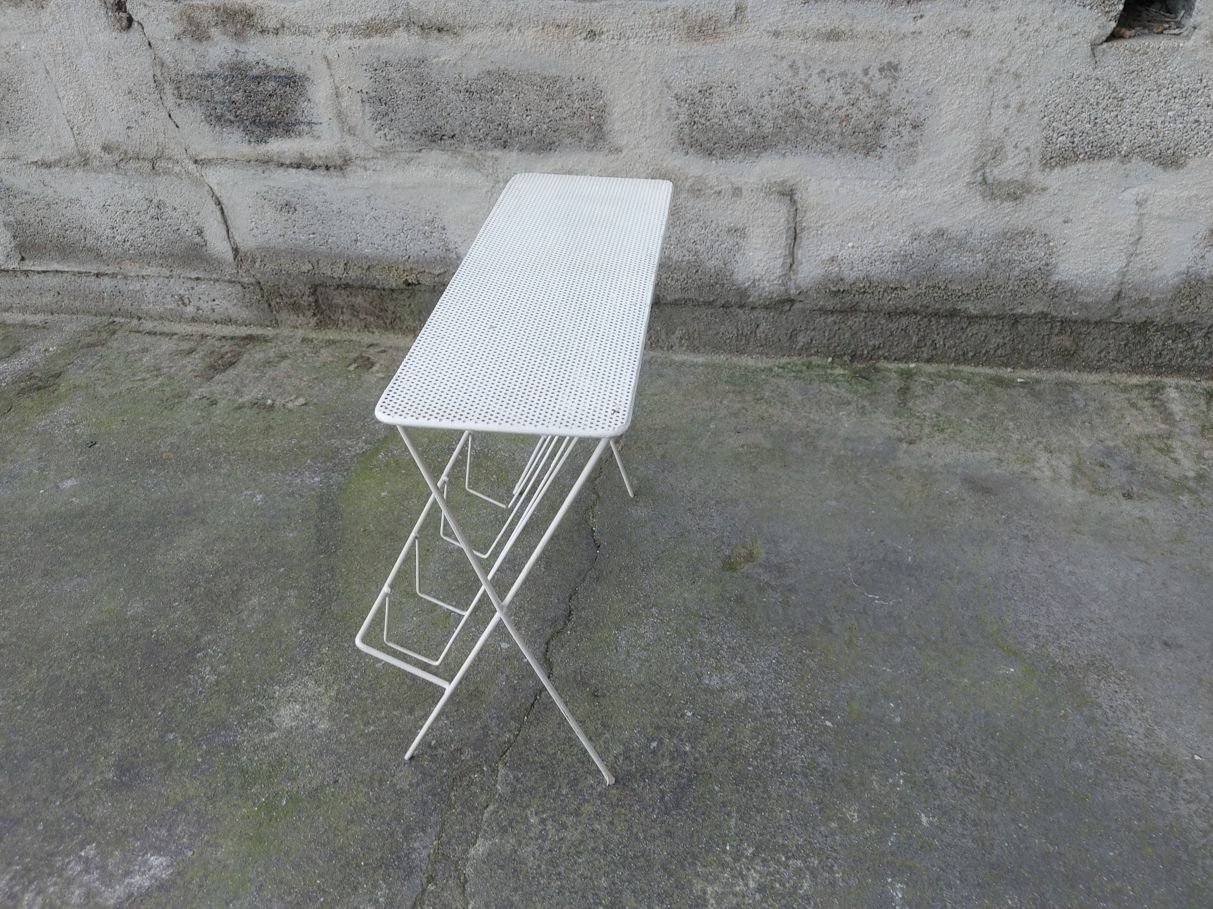 Vintage magazine holder in perforated metal