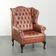Fauteuil à oreilles Chesterfield en cuir de vachette anglais classique avec boutons.
