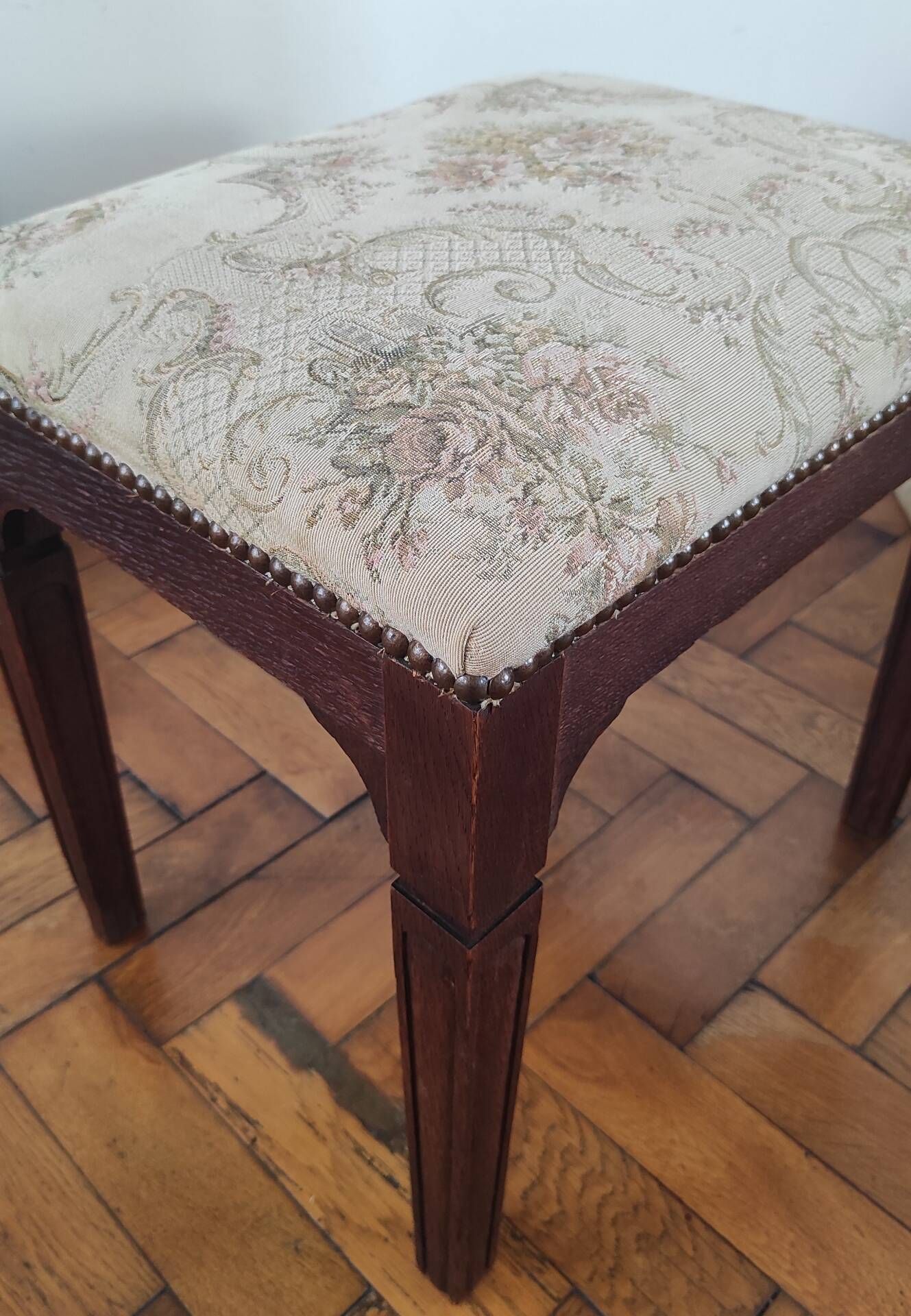 Footrest, vintage stool in solid oak with floral upholstery.