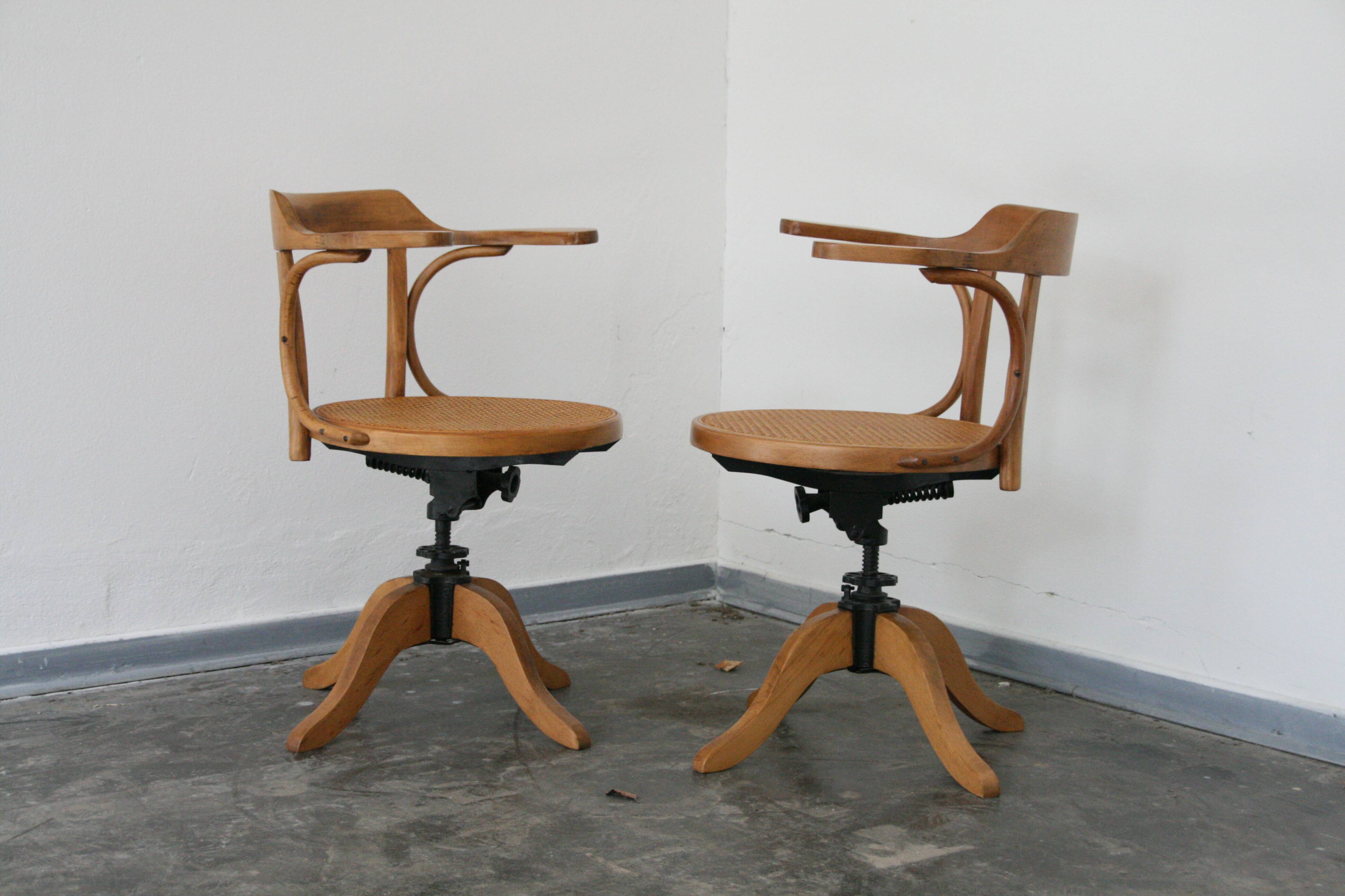 A pair of vintage bent wood svivel chairs by Salvaatore Leone Italy