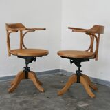 A pair of vintage bent wood svivel chairs by Salvaatore Leone Italy