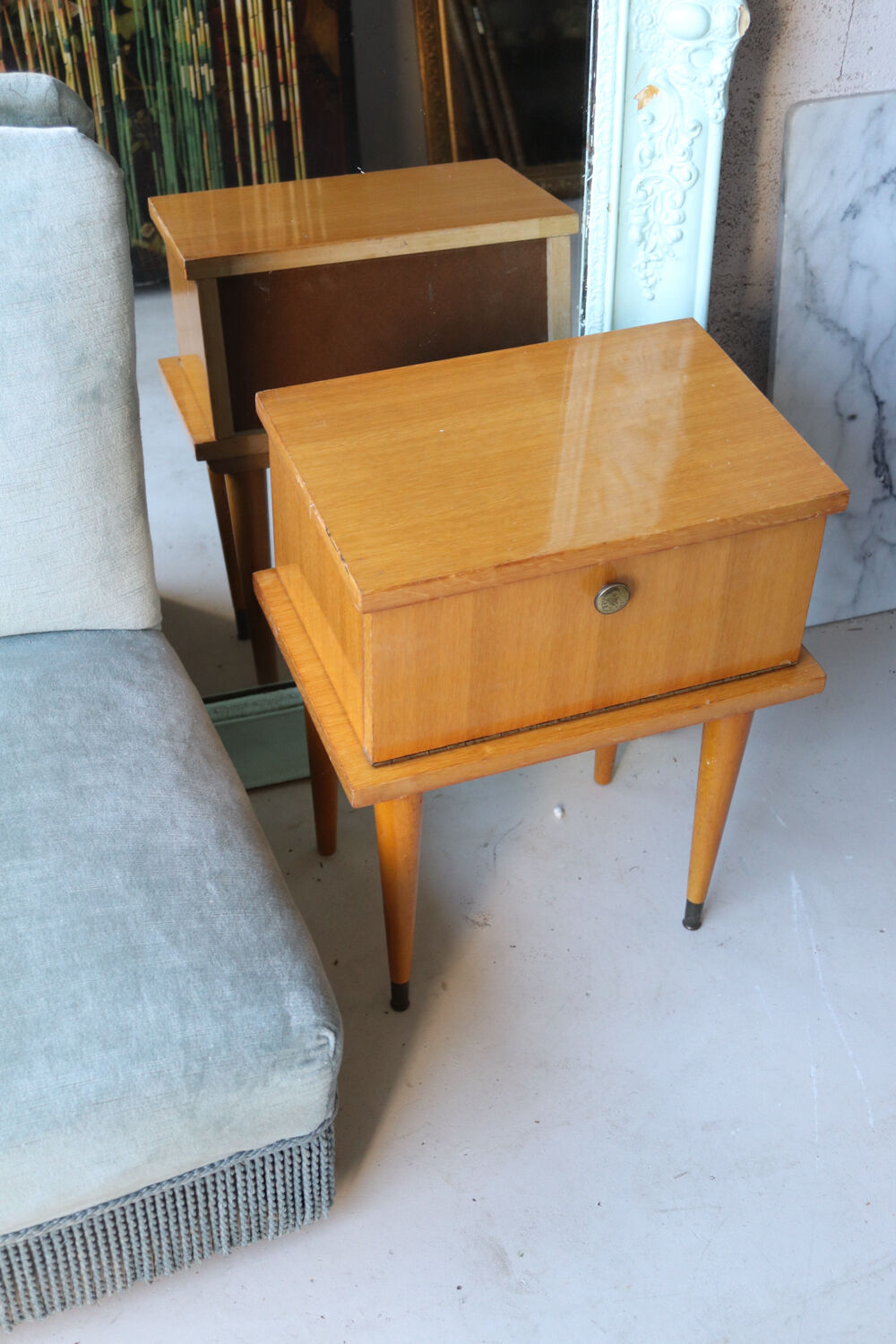Modernist bedside table from the 1950s with compass legs.