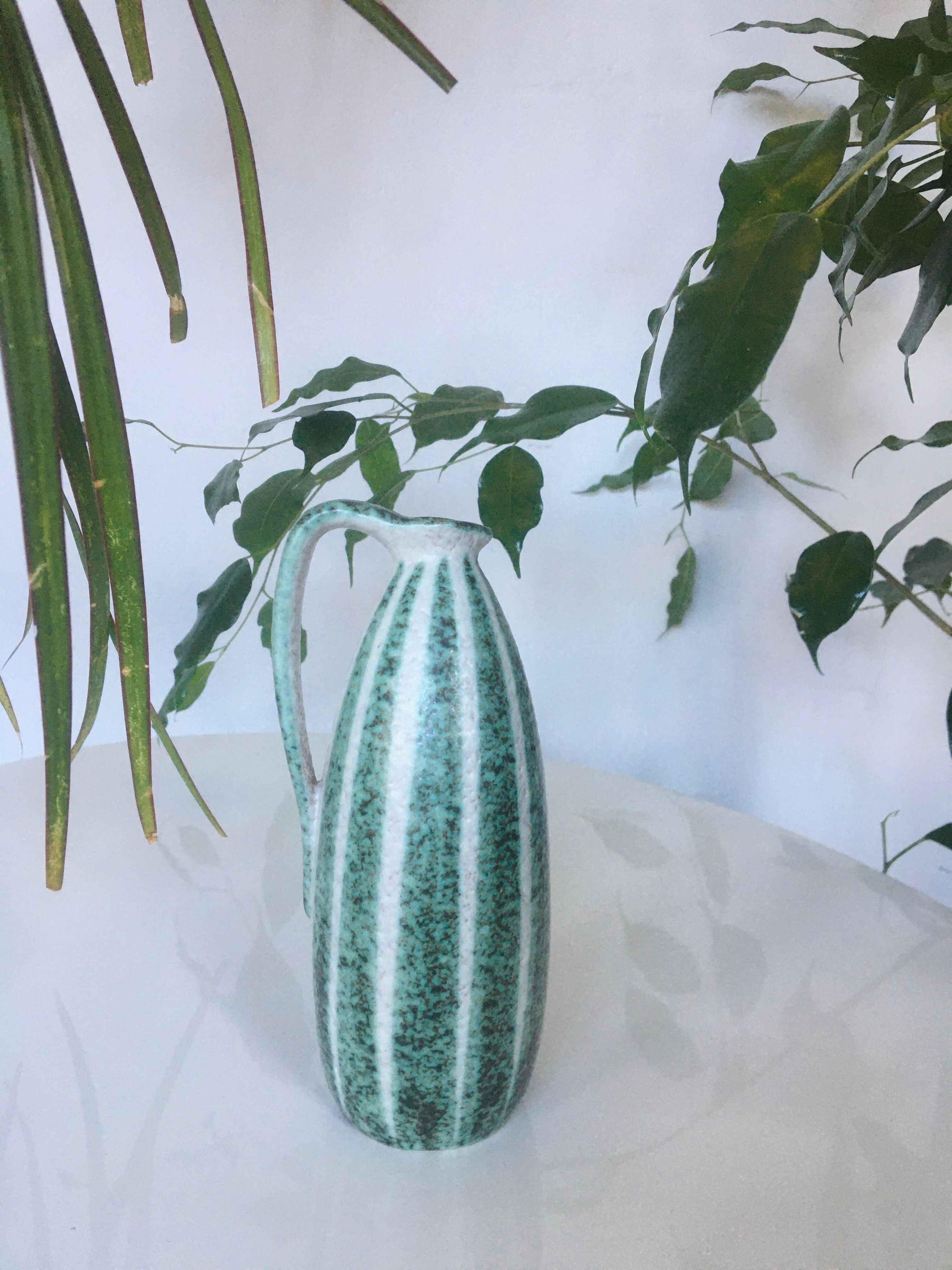 Signed and numbered art ceramics pitcher