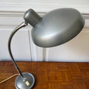 Industrial metal workshop lamp with a gooseneck.