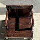 Small low armchair in varnished brown wood