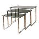 Nest of coffee tables in chrome with smoked glass top.