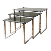 Nest of coffee tables in chrome with smoked glass top.