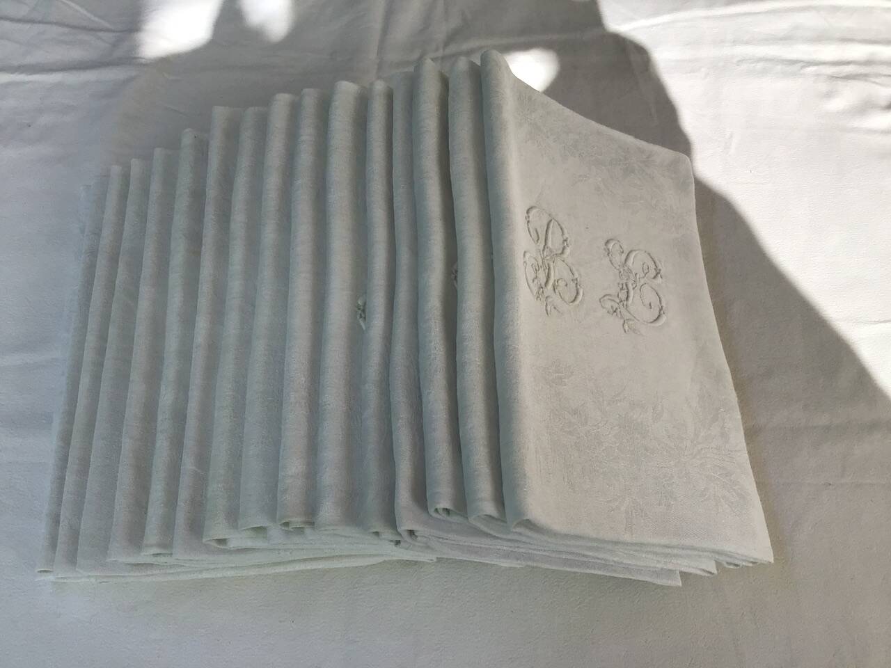 Set of 12 19th century white napkins marked “BL”