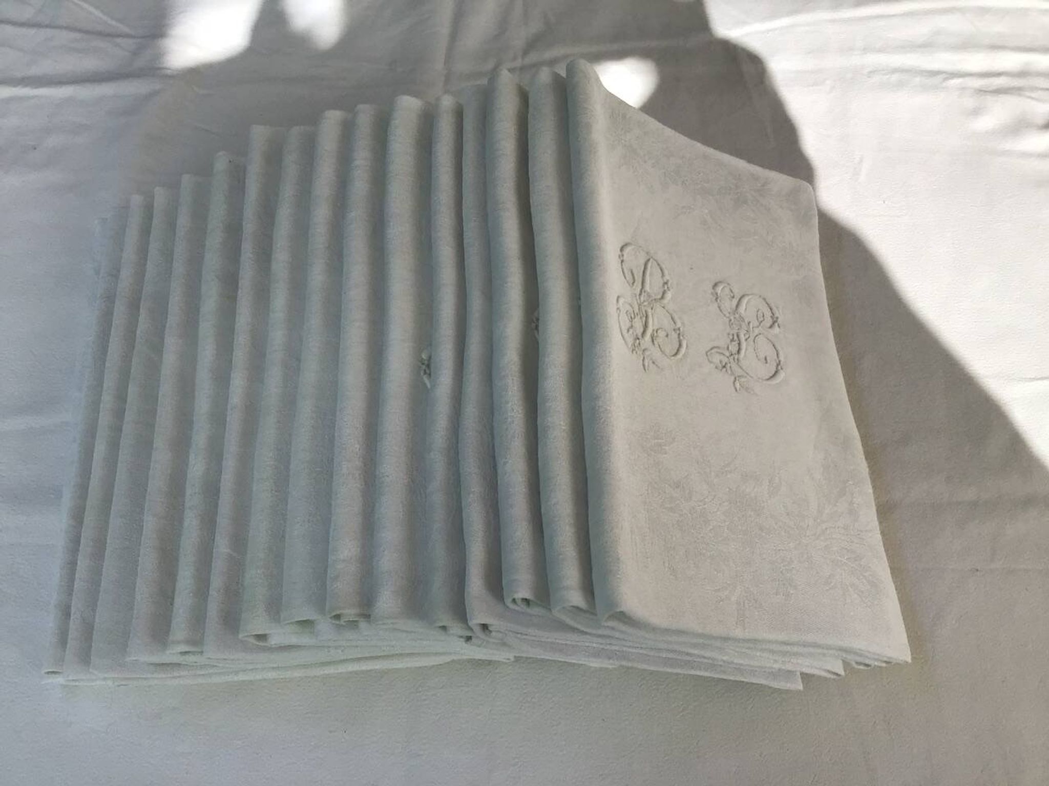 Set of 12 19th century white napkins marked “BL”