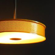 Yellow lacquered perforated metal pendant, in the style of Matégot or Biny.