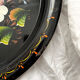 Round black metal tray with vintage flowers