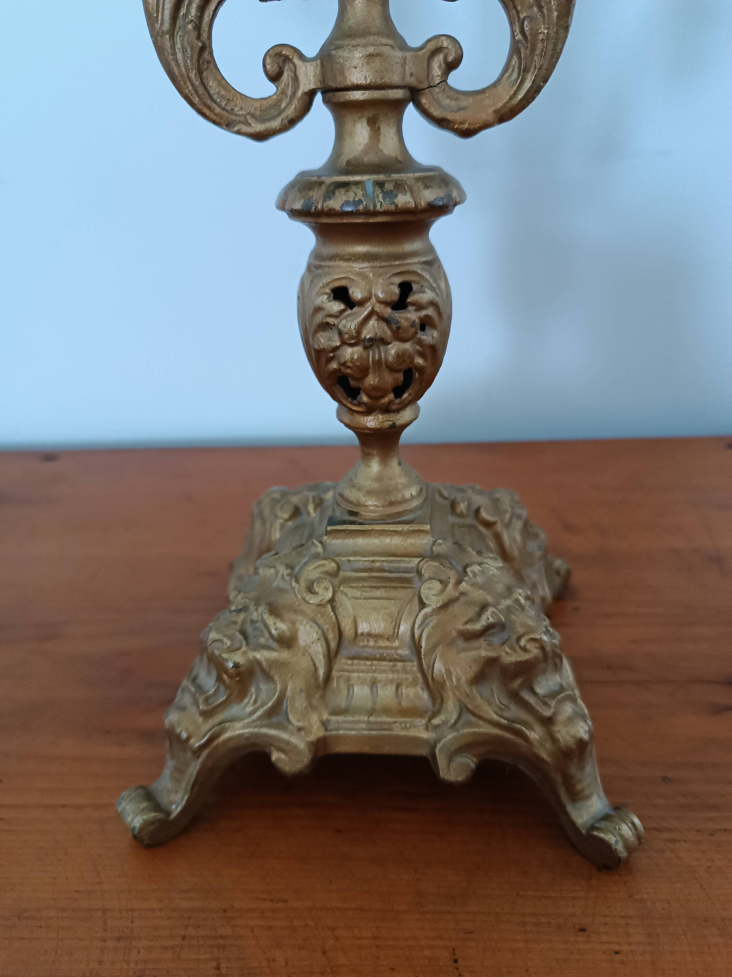 Bronze candlestick with lion head decoration