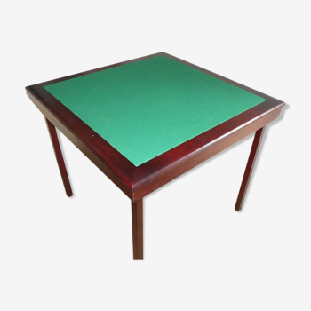 Mahogany colored game table with green carpet
