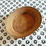 Basket in braided wicker and rattan