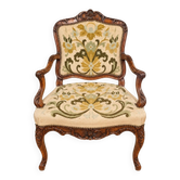 Louis XV cabriolet armchair, carved walnut, petit point tapestry, 18th century.