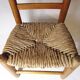 Old child chair in wood and straw