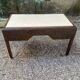Art Deco desk in varnished mahogany.